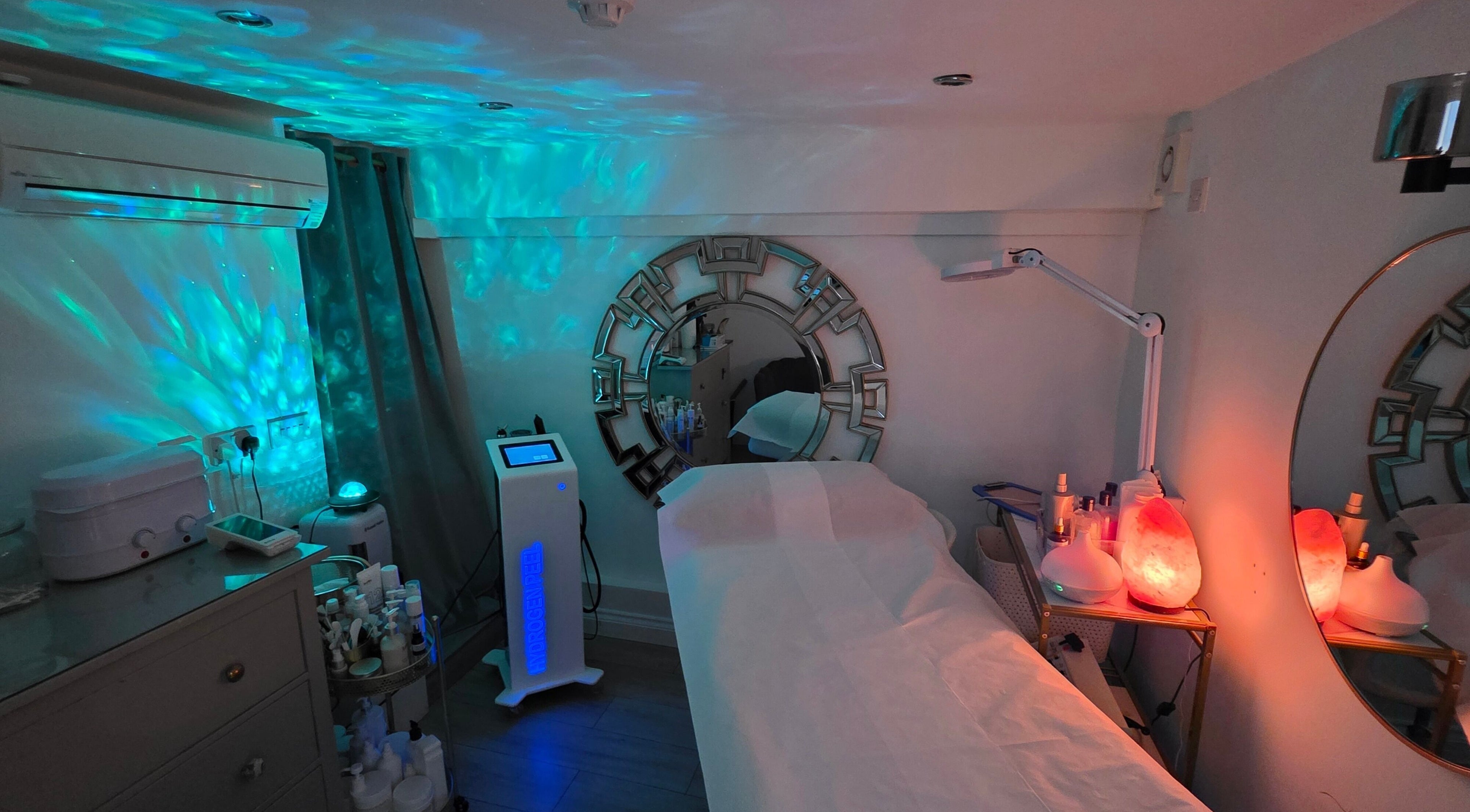 Relaxing treatment room at Wioletta Beauty - Fulham in London, England, GB, with calming blue lights.