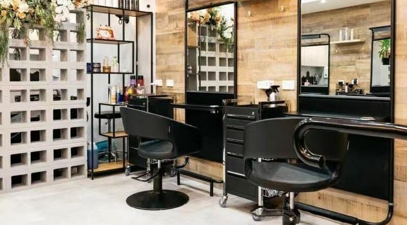 Modern salon setup at Perfect Hairdressing Maroubra, Maroubra, NSW, AU with elegant black styling chairs.