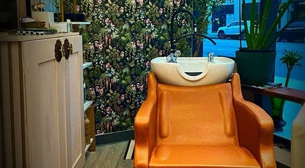 Luxurious salon chair and sink at Glendale Arts+Salon, Chicago, Illinois, US, offering a tranquil experience.