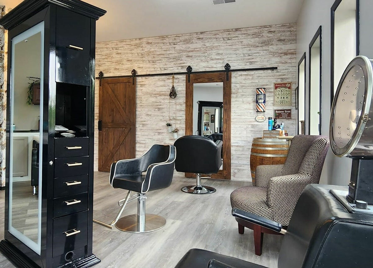 Elegant interior of Revival Hair Studio in Onsted, Michigan, US, featuring stylish chairs and modern decor.