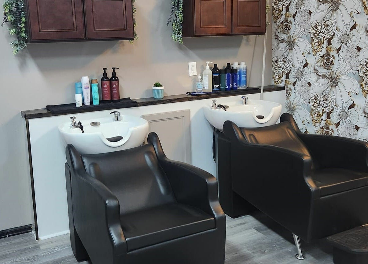 Stylish wash stations at Revival Hair Studio in Onsted, Michigan, US, displaying luxury hair care products.
