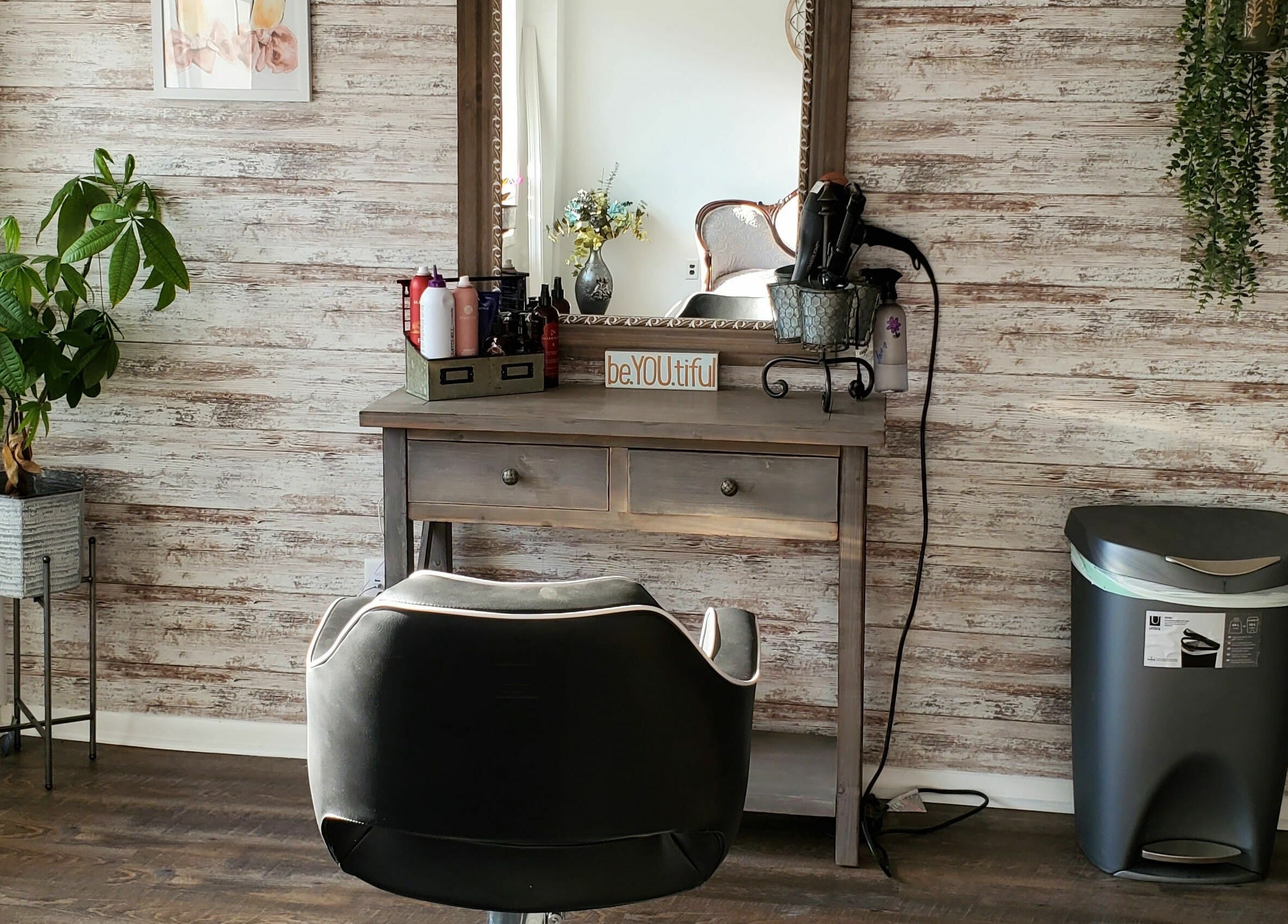 Stylish salon station at Revival Hair Studio in Onsted, Michigan, US, featuring elegant decor and beauty products.
