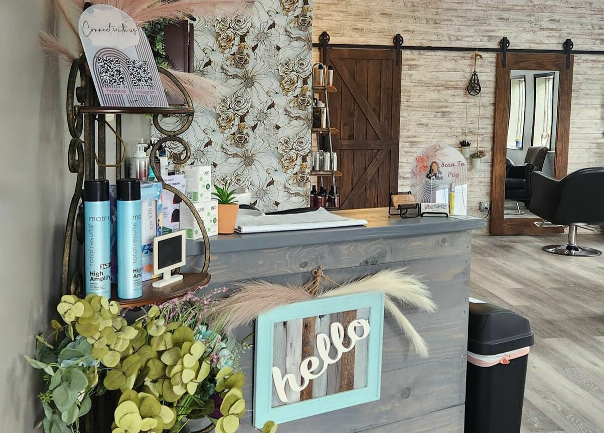 Elegant reception area at Revival Hair Studio in Onsted, Michigan, US, featuring stylish decor and welcoming vibe.