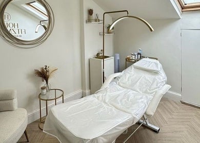 Elegant beauty treatment room at Hollie Fitzmartin Studio and Academy, Atherton, England, GB, featuring a cozy chair.