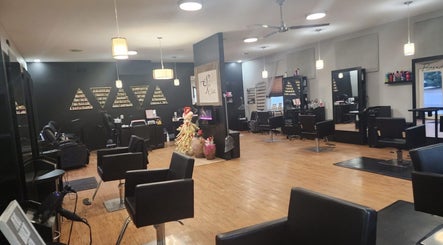 Elegant interior of Starrlight Beauty in Minerva, Ohio, US featuring modern salon chairs and stylish lighting.