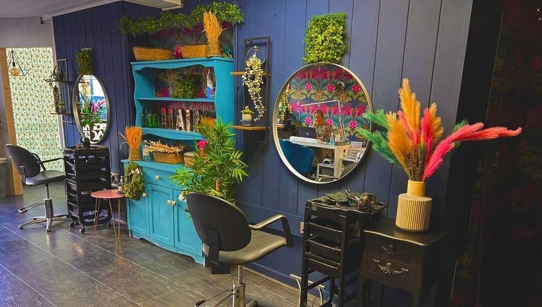 Charming salon interior at Personal Image, Gorseinon, Wales, GB, featuring colorful decor and stylish mirrors.