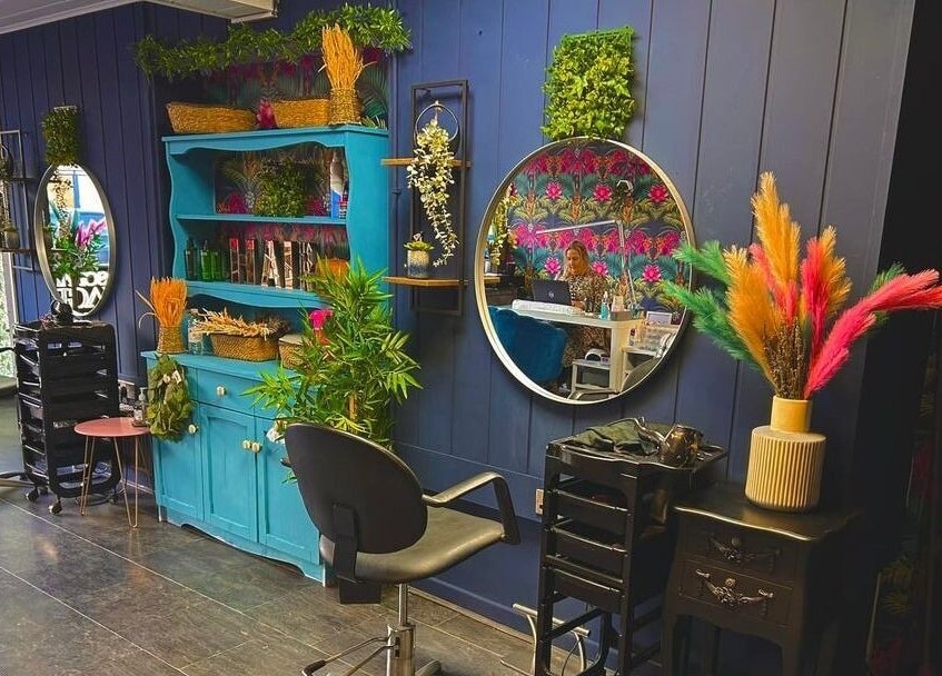 Charming salon interior at Personal Image, Gorseinon, Wales, GB, featuring colorful decor and stylish mirrors.