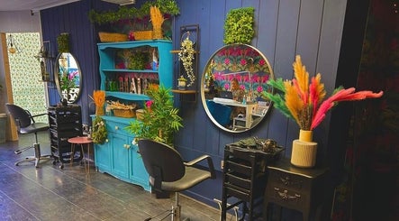 Charming salon interior at Personal Image, Gorseinon, Wales, GB, featuring colorful decor and stylish mirrors.