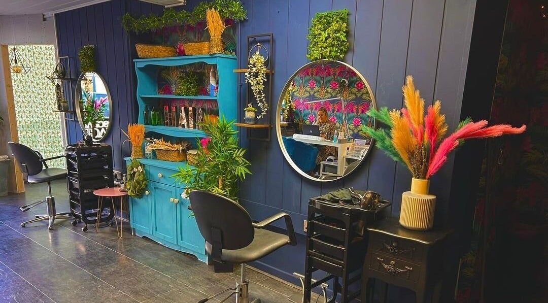 Charming salon interior at Personal Image, Gorseinon, Wales, GB, featuring colorful decor and stylish mirrors.