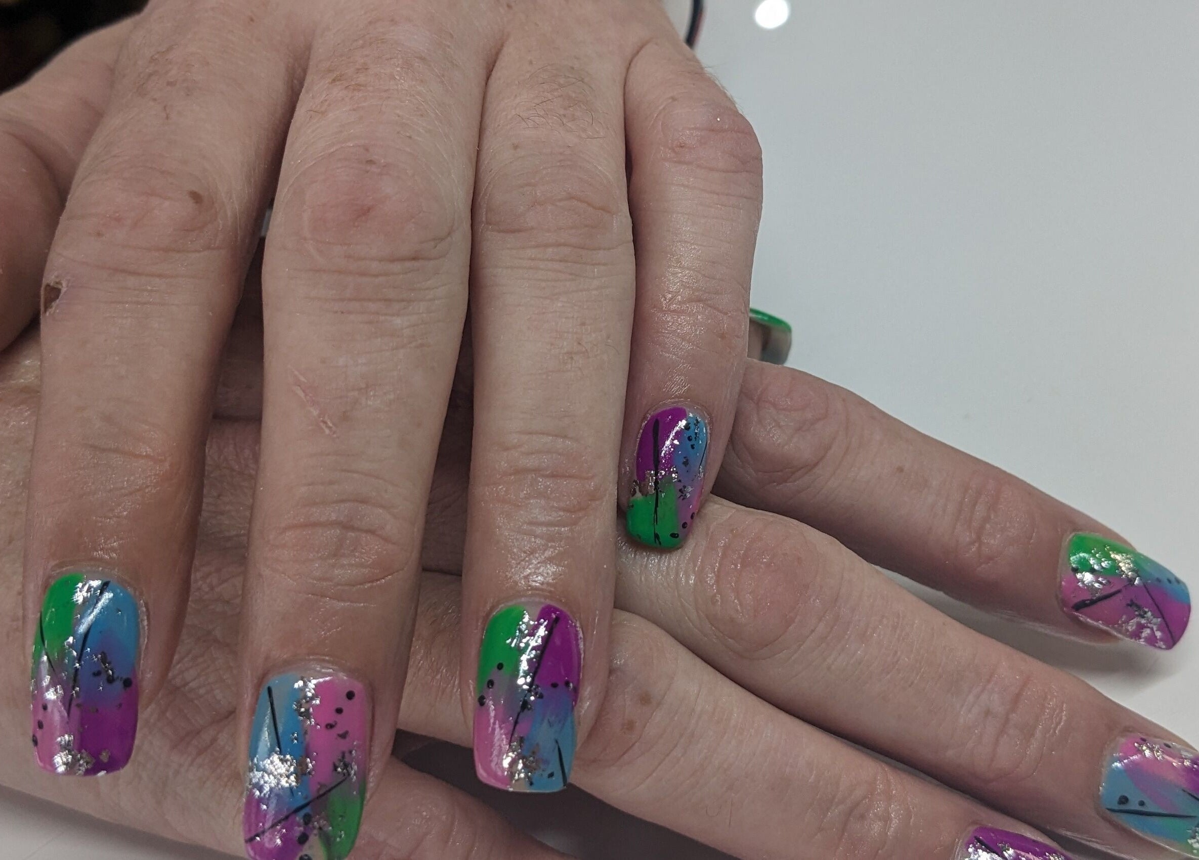 Colorful nail art at Personal Image, Gorseinon, Wales, GB showcasing vibrant designs.