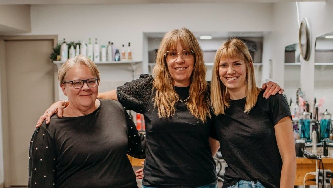 Friendly staff at The Curly Temple Salon in Burns Lake, British Columbia, CA, welcoming clients with warm smiles.