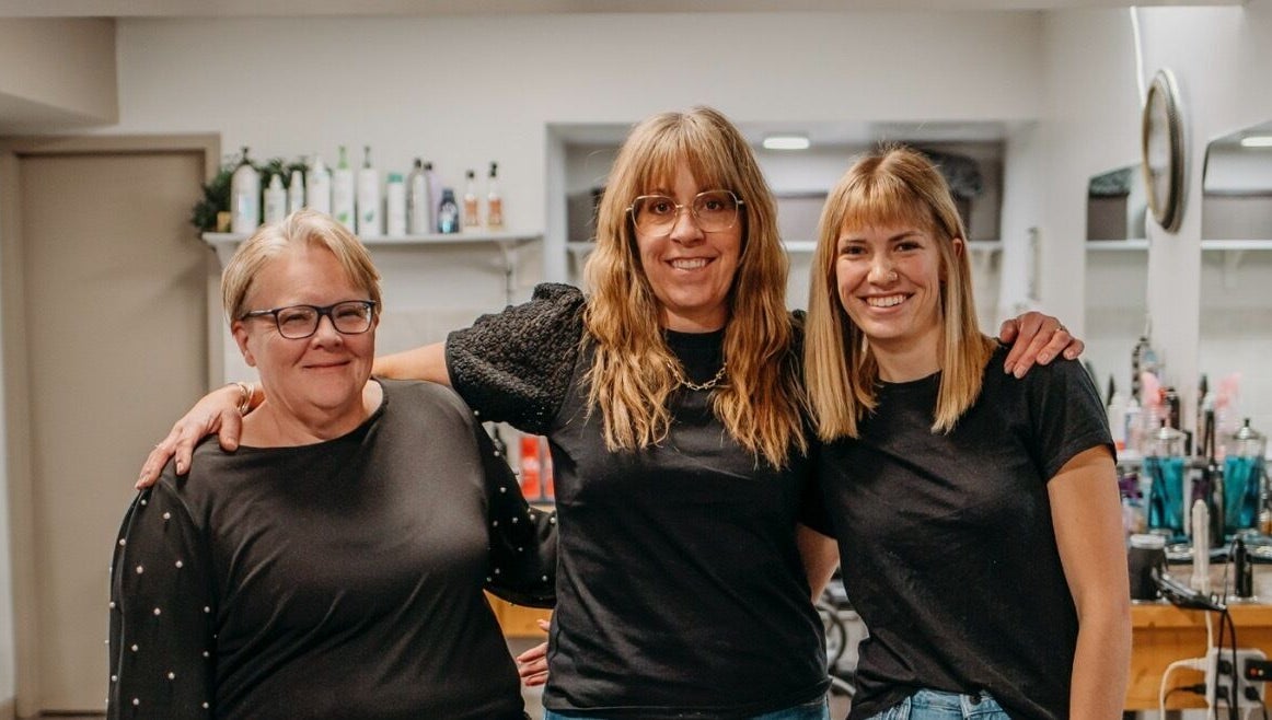 Friendly staff at The Curly Temple Salon in Burns Lake, British Columbia, CA, welcoming clients with warm smiles.