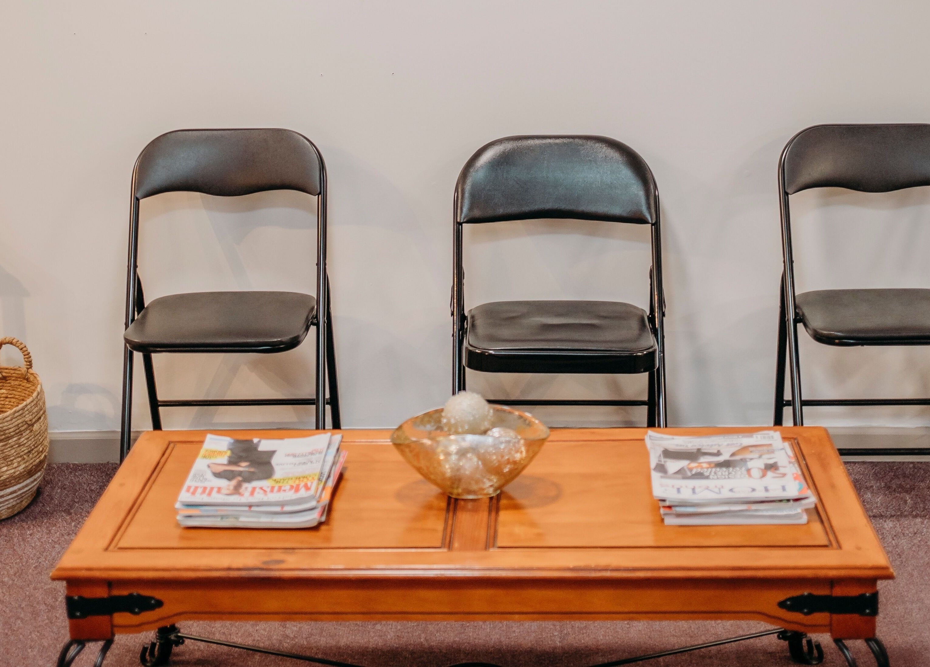 Inviting waiting area at The Curly Temple Salon, Burns Lake, British Columbia, CA with chairs and a coffee table.