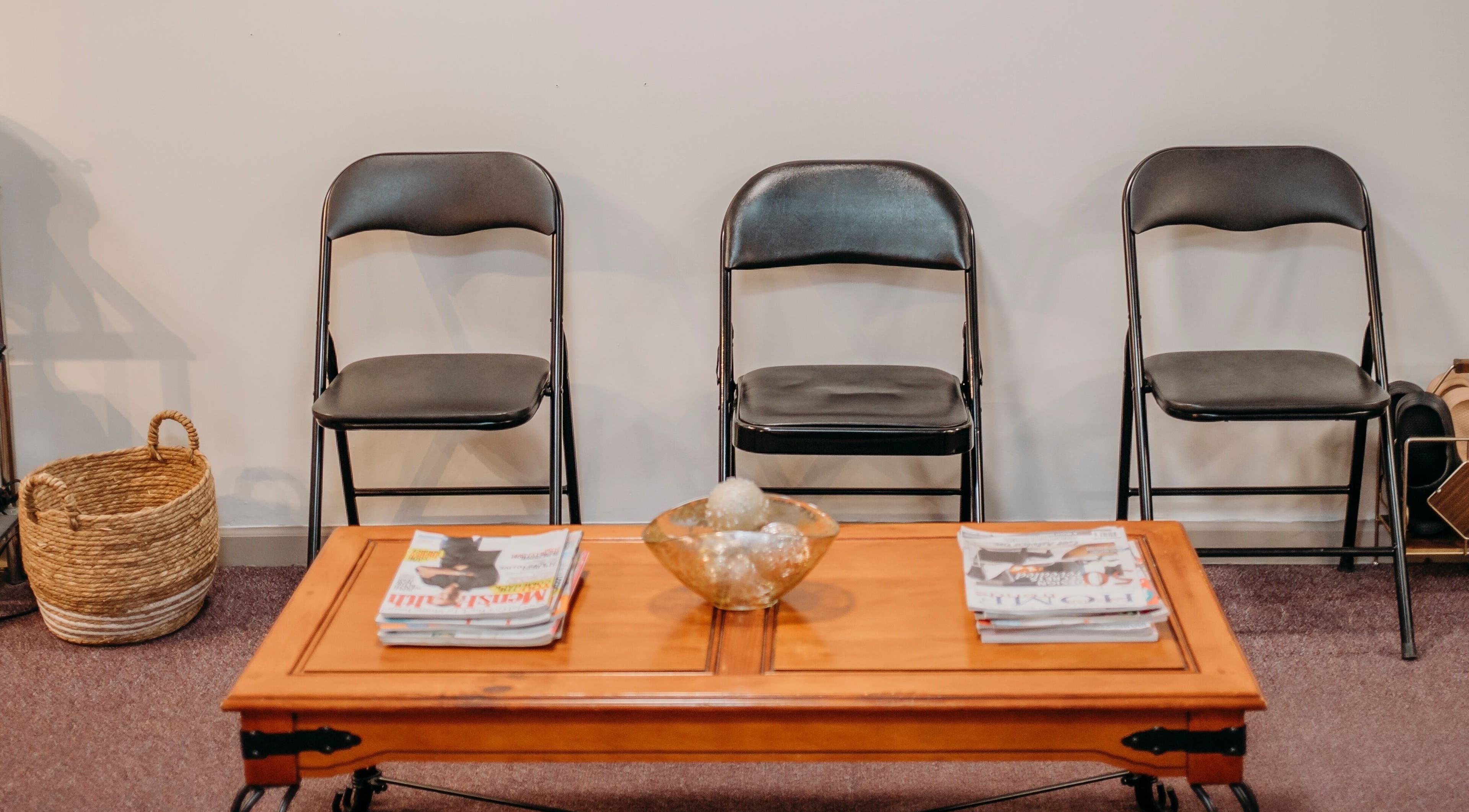 Inviting waiting area at The Curly Temple Salon, Burns Lake, British Columbia, CA with chairs and a coffee table.