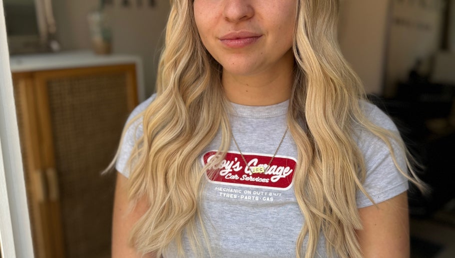 Blonde hair with soft curls styled at Seats Hair Studio, Leicester, England, GB.