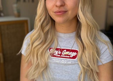Blonde hair with soft curls styled at Seats Hair Studio, Leicester, England, GB.