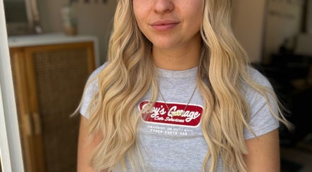 Blonde hair with soft curls styled at Seats Hair Studio, Leicester, England, GB.