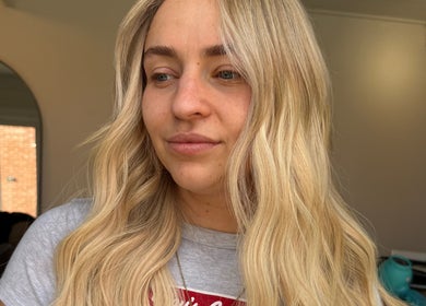 Close-up of a woman with blonde hair styled at TIEGAN SEATON (Seats Hair Studio), Anstey, England, GB.