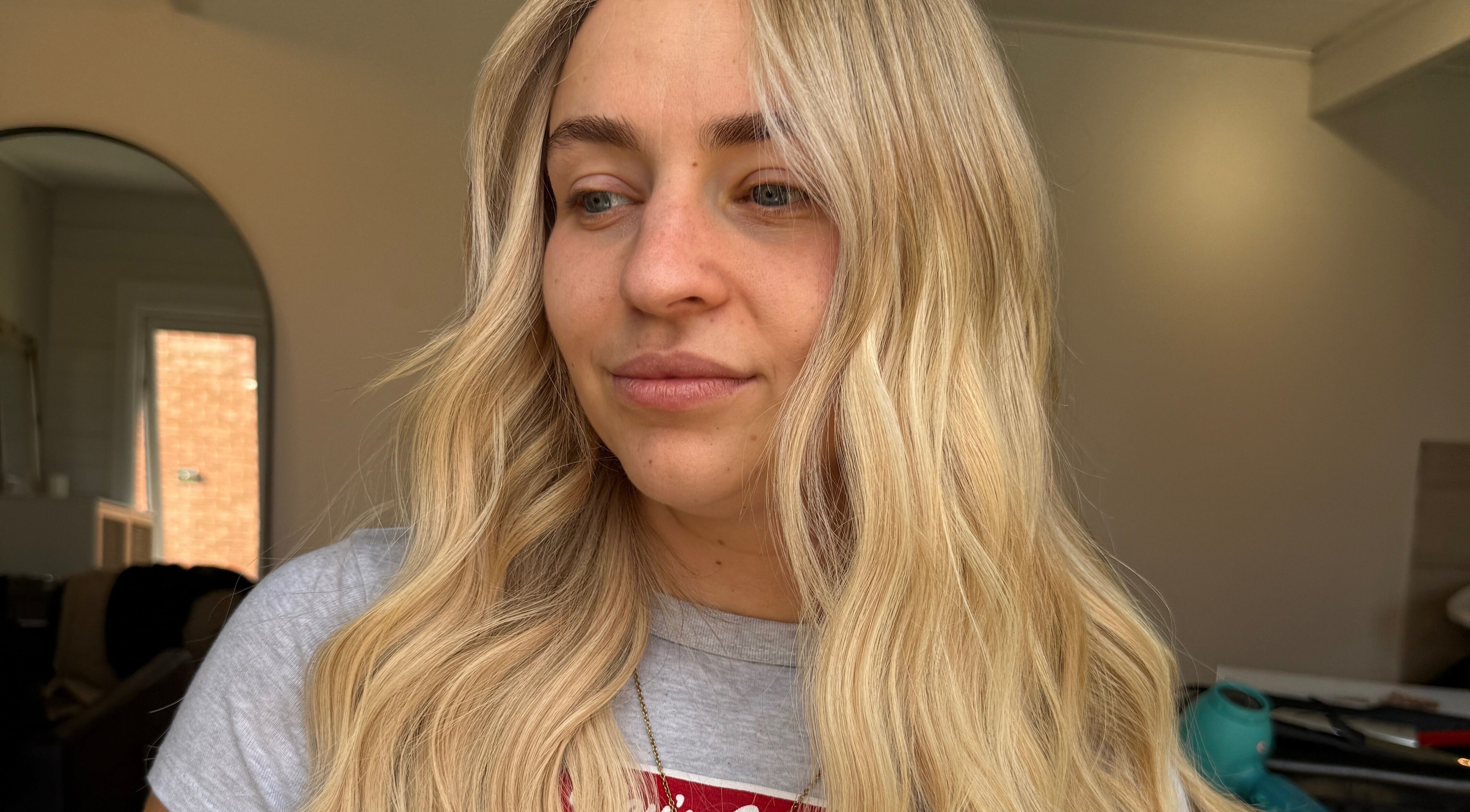 Close-up of a woman with blonde hair styled at TIEGAN SEATON (Seats Hair Studio), Anstey, England, GB.