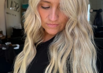 Stylish blonde waves at TIEGAN SEATON (Seats Hair Studio), Anstey, England, GB.