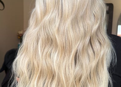Blonde wavy hair beautifully styled at TIEGAN SEATON (Seats Hair Studio), Anstey, England, GB.