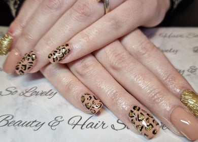 Leopard print and gold glitter nails by Beauty and Hair So Lovely, Braunstone Town, England, GB.
