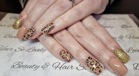 Leopard print and gold glitter nails by Beauty and Hair So Lovely, Braunstone Town, England, GB.