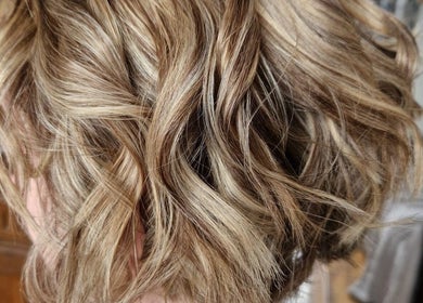 Elegant blonde waves styled at Beauty and Hair So Lovely, Braunstone Town, England, GB.