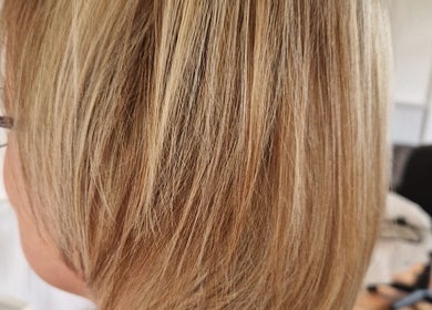 Beautiful blonde hair styled at Beauty and Hair So Lovely, Braunstone Town, England, GB.