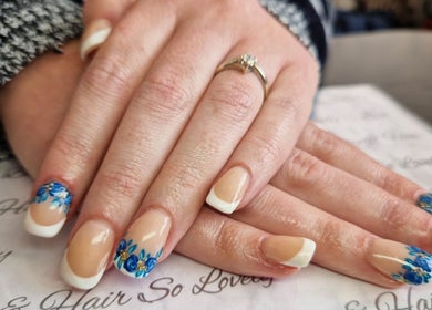 Blue floral nail art at Beauty and Hair So Lovely, Braunstone Town, England, GB.