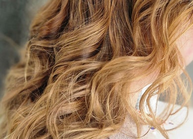 Beautifully styled wavy blonde hair at Beauty and Hair So Lovely, Braunstone Town, England, GB.