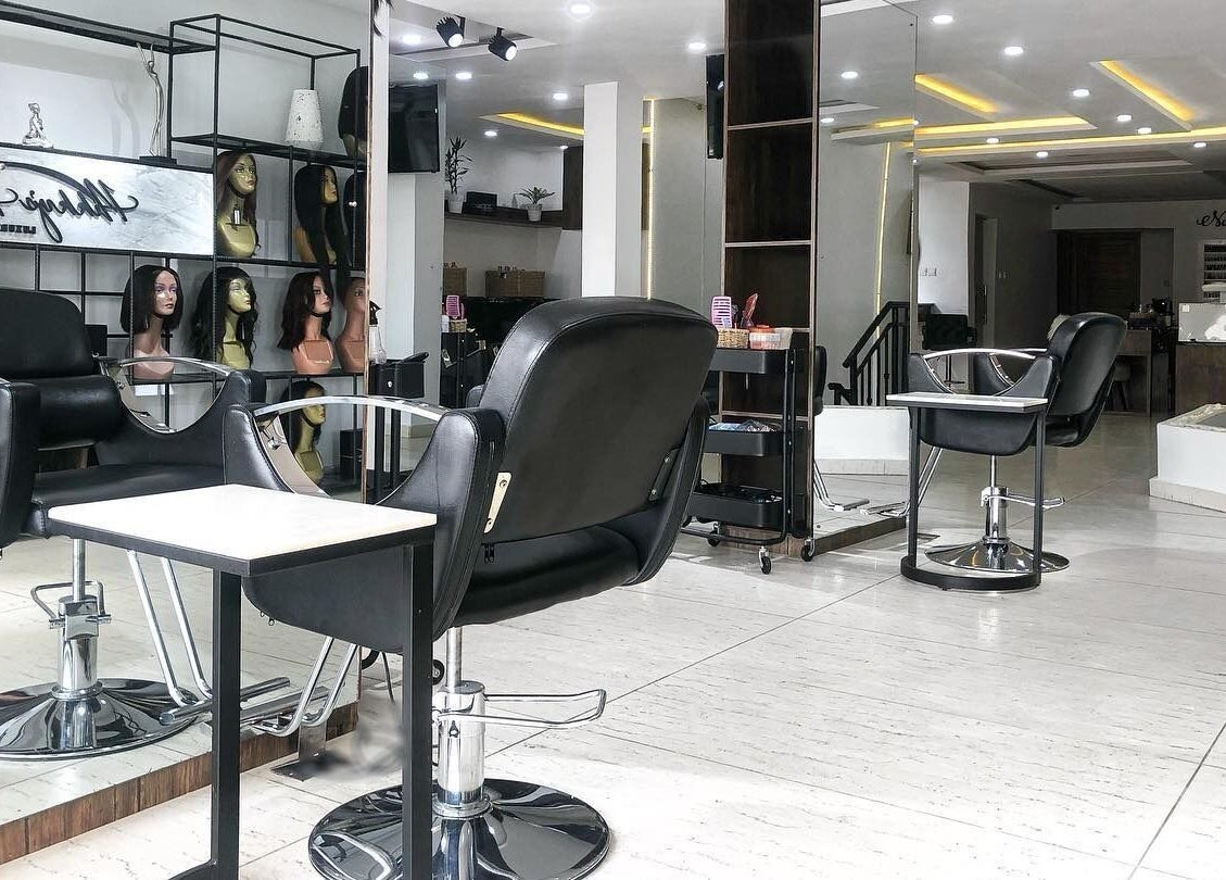 Interior of The Hikky's Hair Studio in Lagos, Lagos, NG showcasing modern salon chairs and decor.