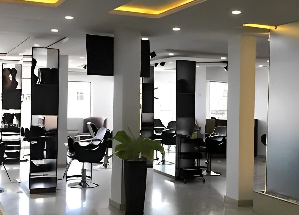 Sleek interior of The Hikky's Hair Studio, Lagos, Lagos, NG, featuring modern chairs and decor.