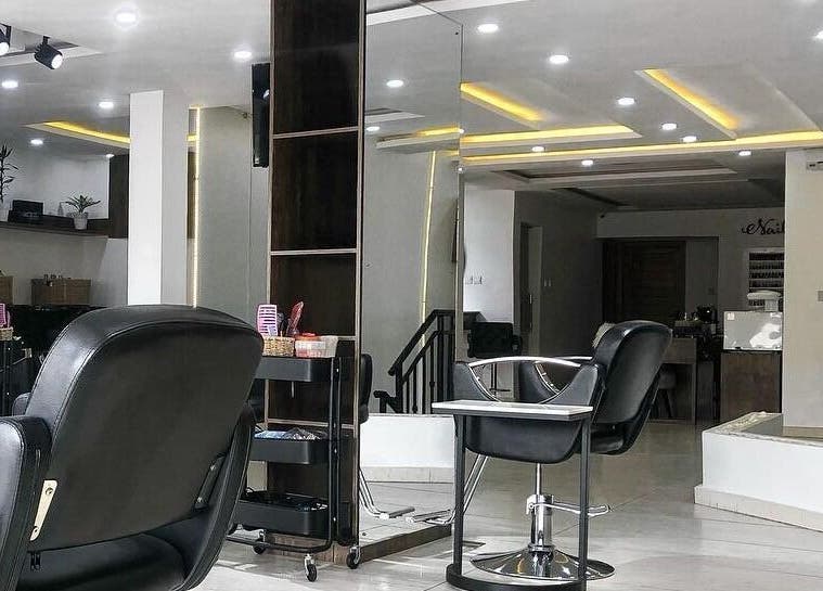 Modern interior of The Hikky's Hair Studio in Lagos, Lagos, NG featuring sleek chairs and stylish decor.