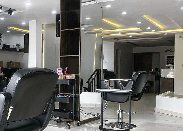 Modern interior of The Hikky's Hair Studio in Lagos, Lagos, NG featuring sleek chairs and stylish decor.