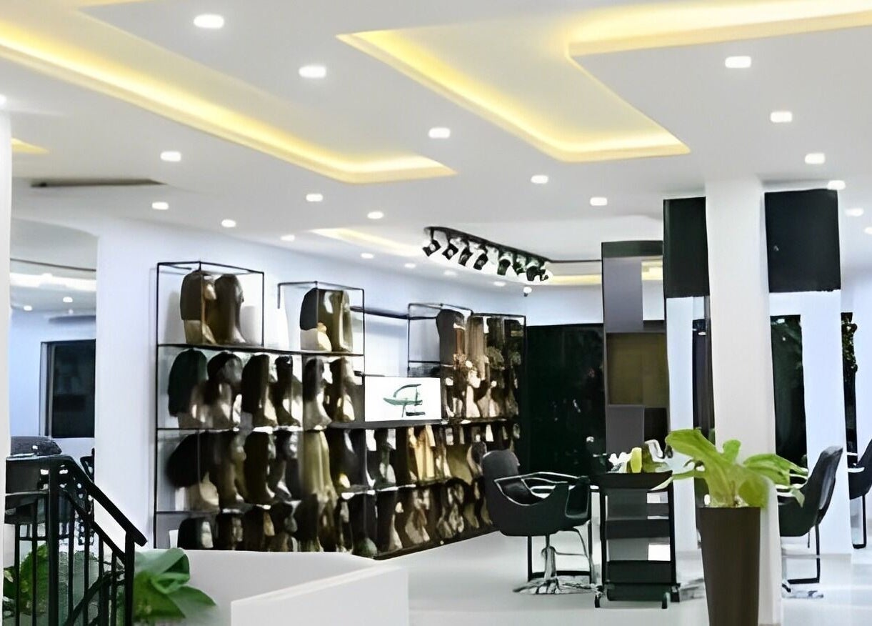 The Hikky's Hair Studio in Lagos, NG features modern interiors with wig displays and stylish salon chairs.