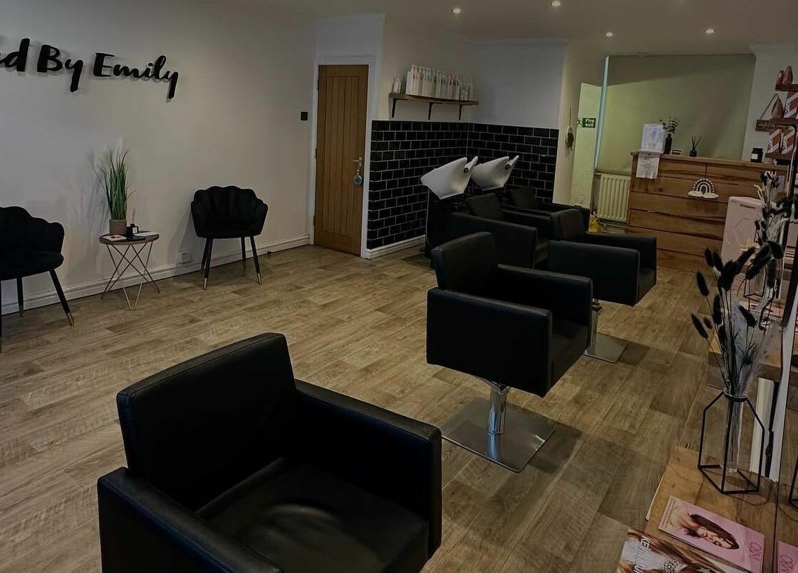 Styled By Emily LTD's chic interior in Darwen, England showcasing modern black chairs and serene ambiance.