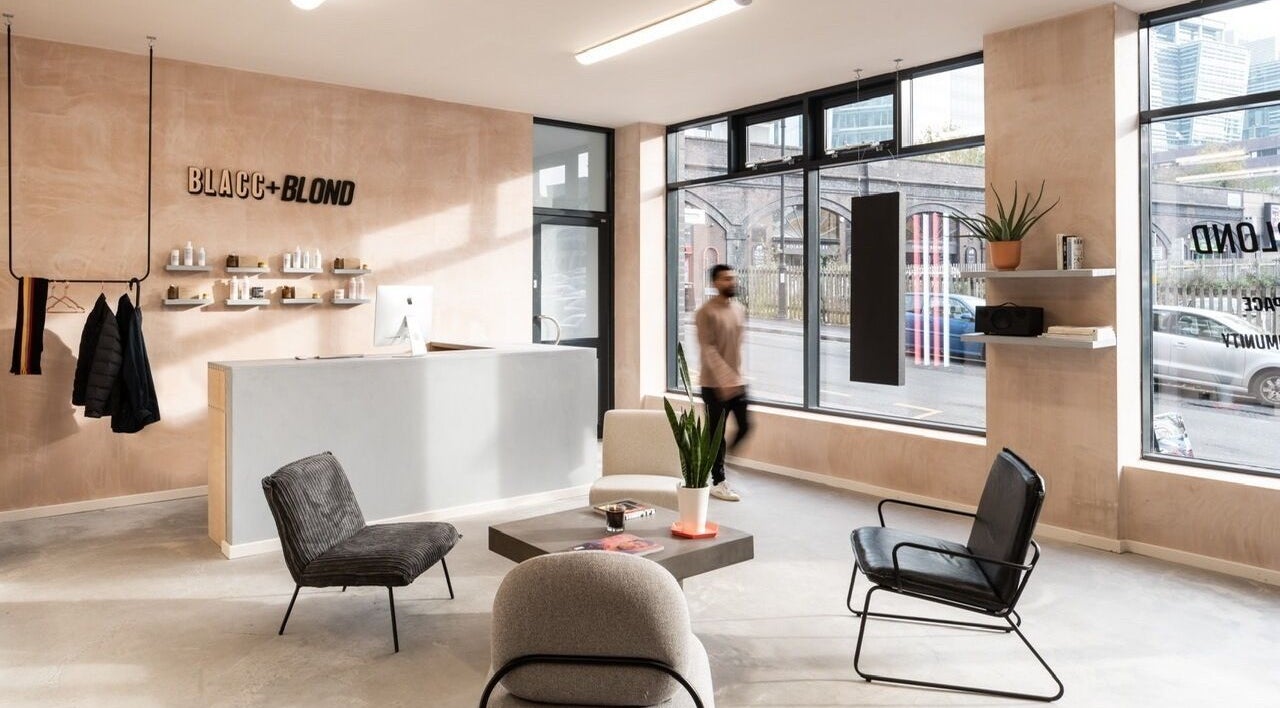 Modern interior of BLACC + BLOND, Birmingham, England, GB with sleek design and comfortable seating.