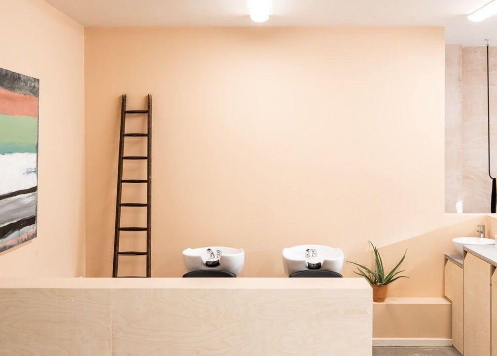Chic wash area in BLACC + BLOND, Birmingham, England, GB featuring basins and stylish decor.