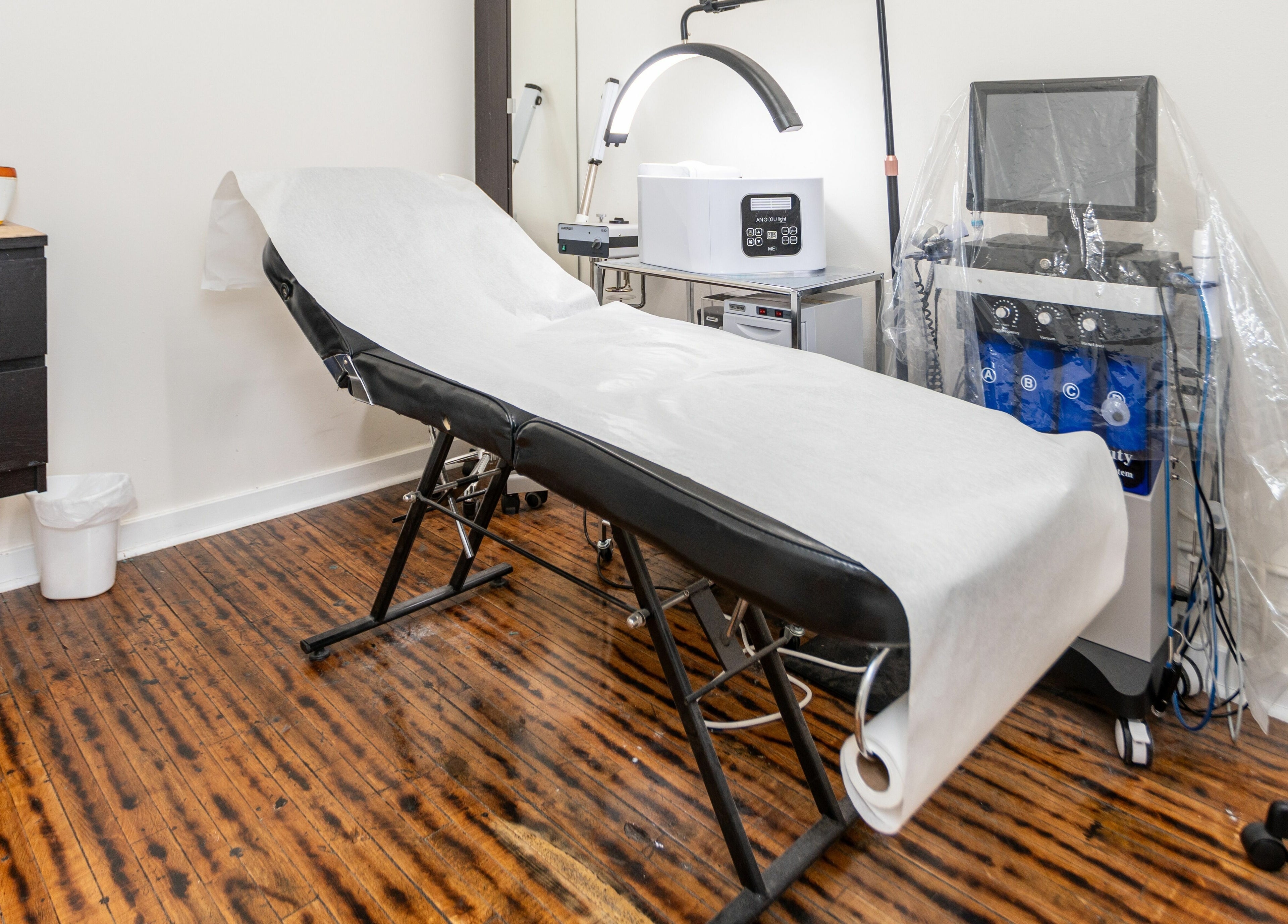 Spa room at Scissor's Palace, Evanston, Illinois, US featuring a treatment table and modern equipment.