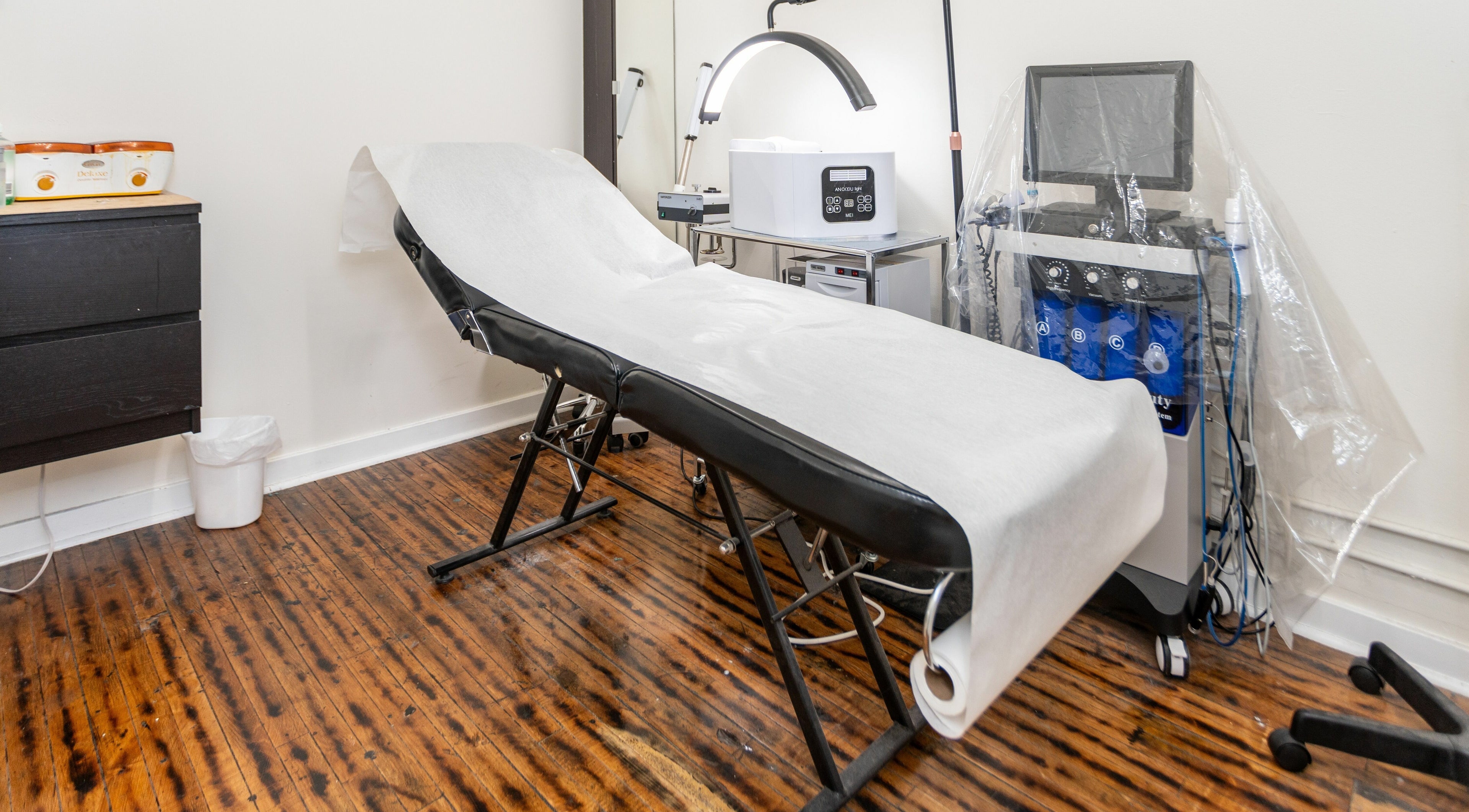 Spa room at Scissor's Palace, Evanston, Illinois, US featuring a treatment table and modern equipment.