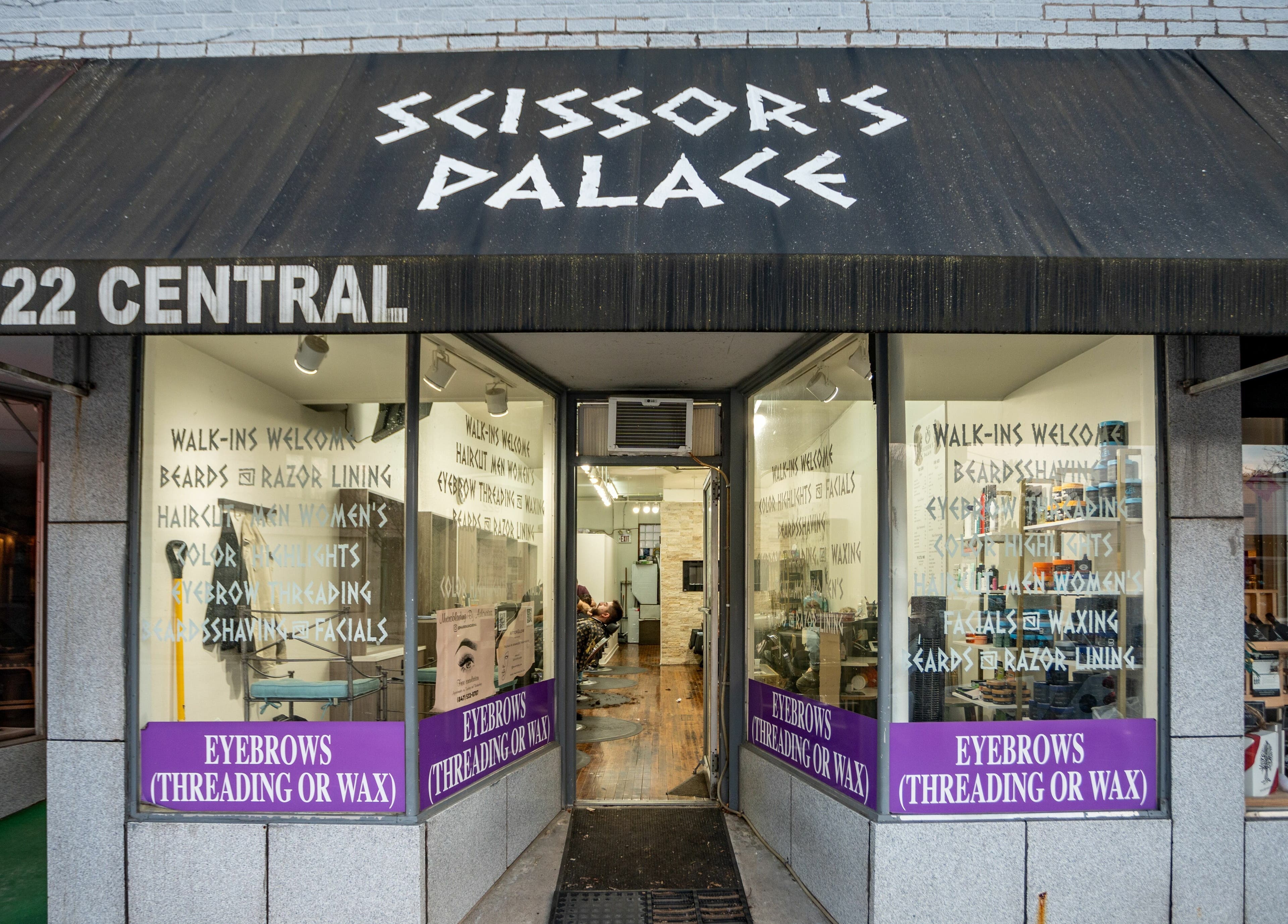 Entrance of Scissor's Palace, Evanston, Illinois, US showcasing eyebrow threading services.