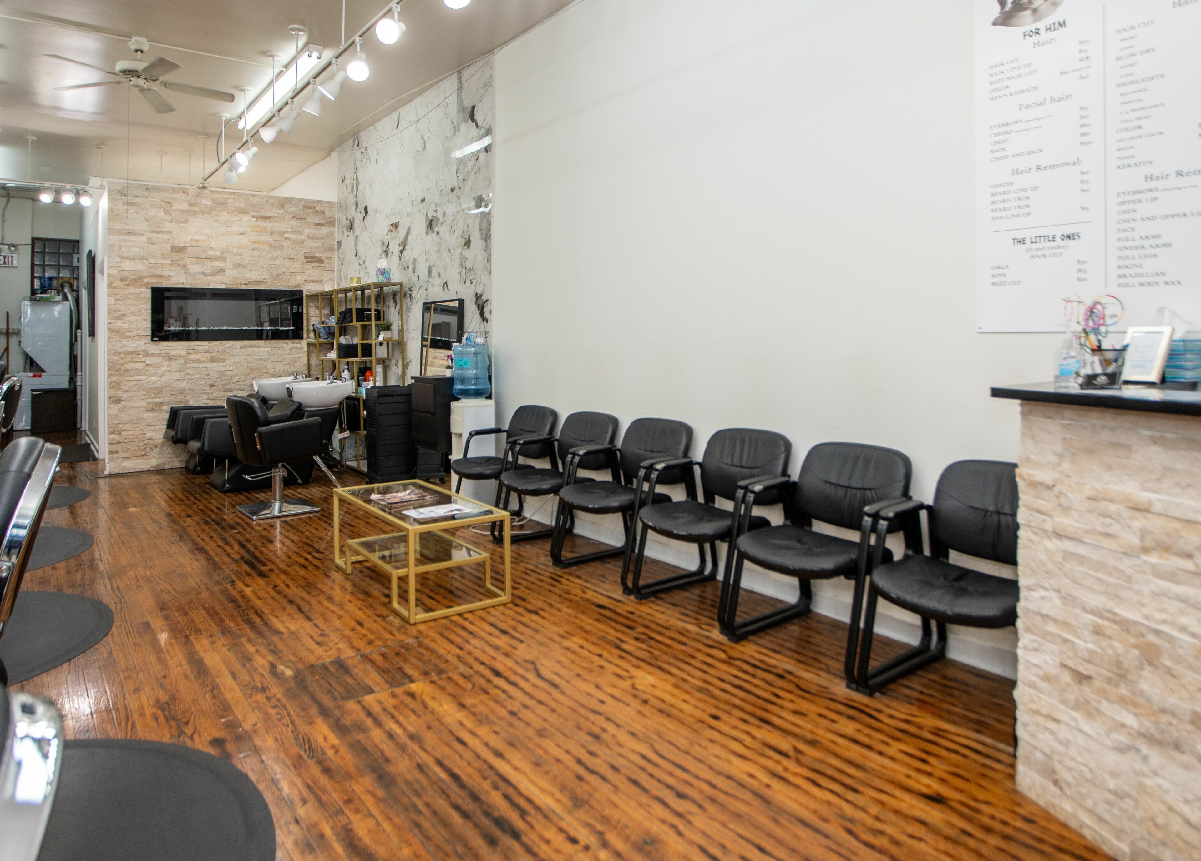 Chic salon interior at Scissor's Palace, Evanston, Illinois, US with stylish chairs and modern décor.