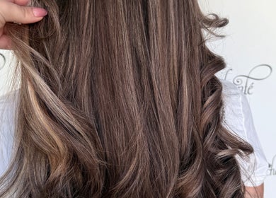 Beautifully styled hair with highlights at Enchante Hair Nails Barber, Il-Mosta, MT.
