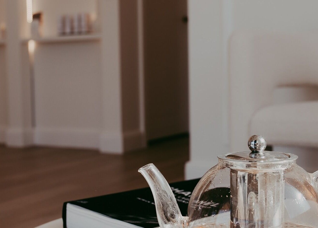 Glass teapot on a table at Meridian Aesthetics Yarrabilba, Yarrabilba, Queensland, AU, creating a relaxing atmosphere.