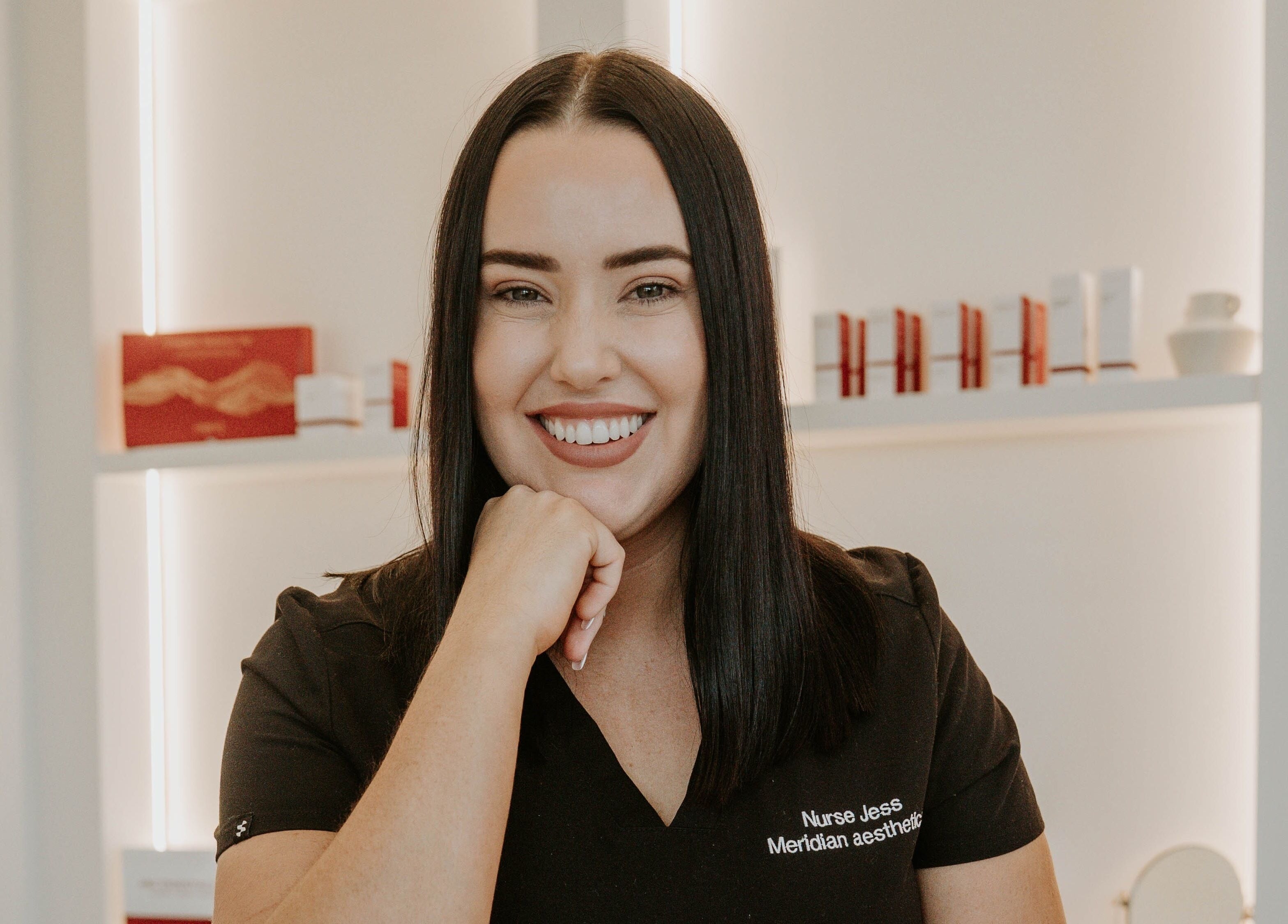 Smiling aesthetic nurse at Meridian Aesthetics Yarrabilba, Yarrabilba, Queensland, AU spa reception.