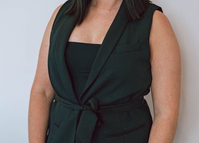 Businesswoman in black attire at Meridian Aesthetics | Surfers Paradise, Queensland, AU.