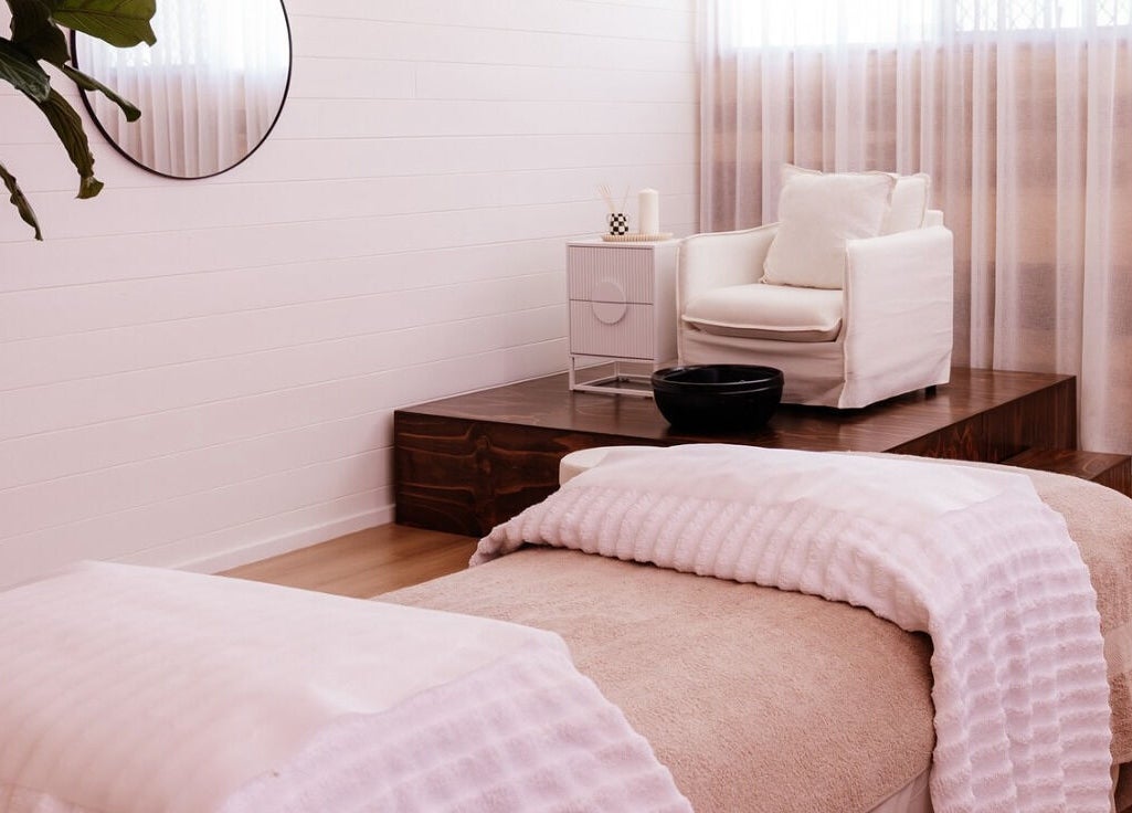 Relaxing treatment room at Studio Rebecca Greaves, Devonport, Tasmania, AU with cozy seating and soft lighting.
