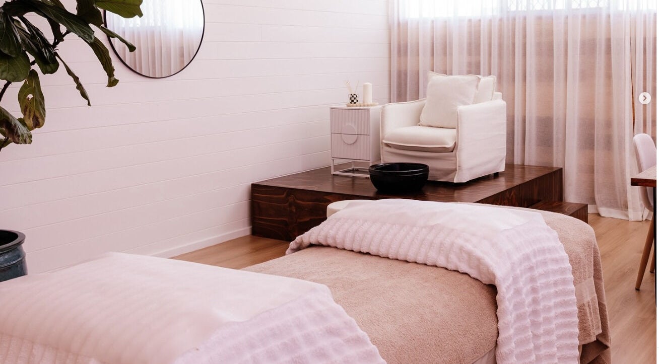Relaxing treatment room at Studio Rebecca Greaves, Devonport, Tasmania, AU with cozy seating and soft lighting.