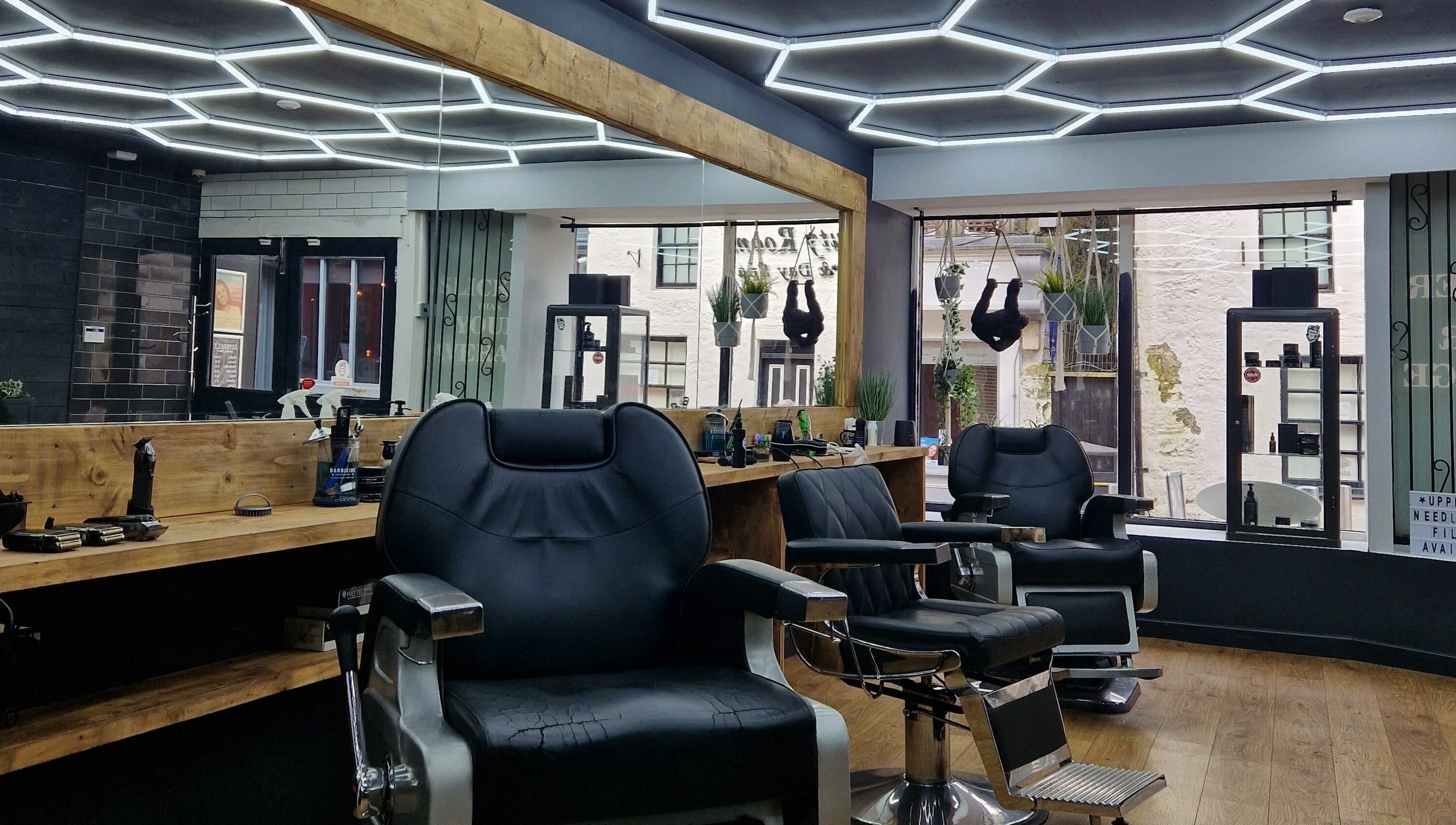 Sleek barber chairs at Uppercut, Kilsyth, Scotland, GB, showcasing contemporary interior design.